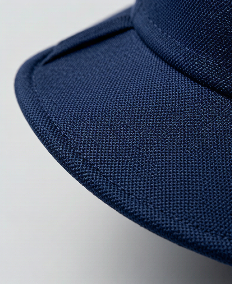 Close-up of hat brim fabric weave detail showing tight weave construction that provides UPF 50+ UV protection