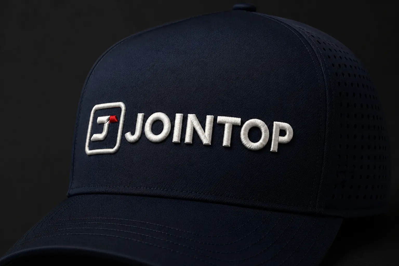 JoinTop logo in 3D puff embroidery on a navy five-panel laser-perforated performance hat with a seamless front panel